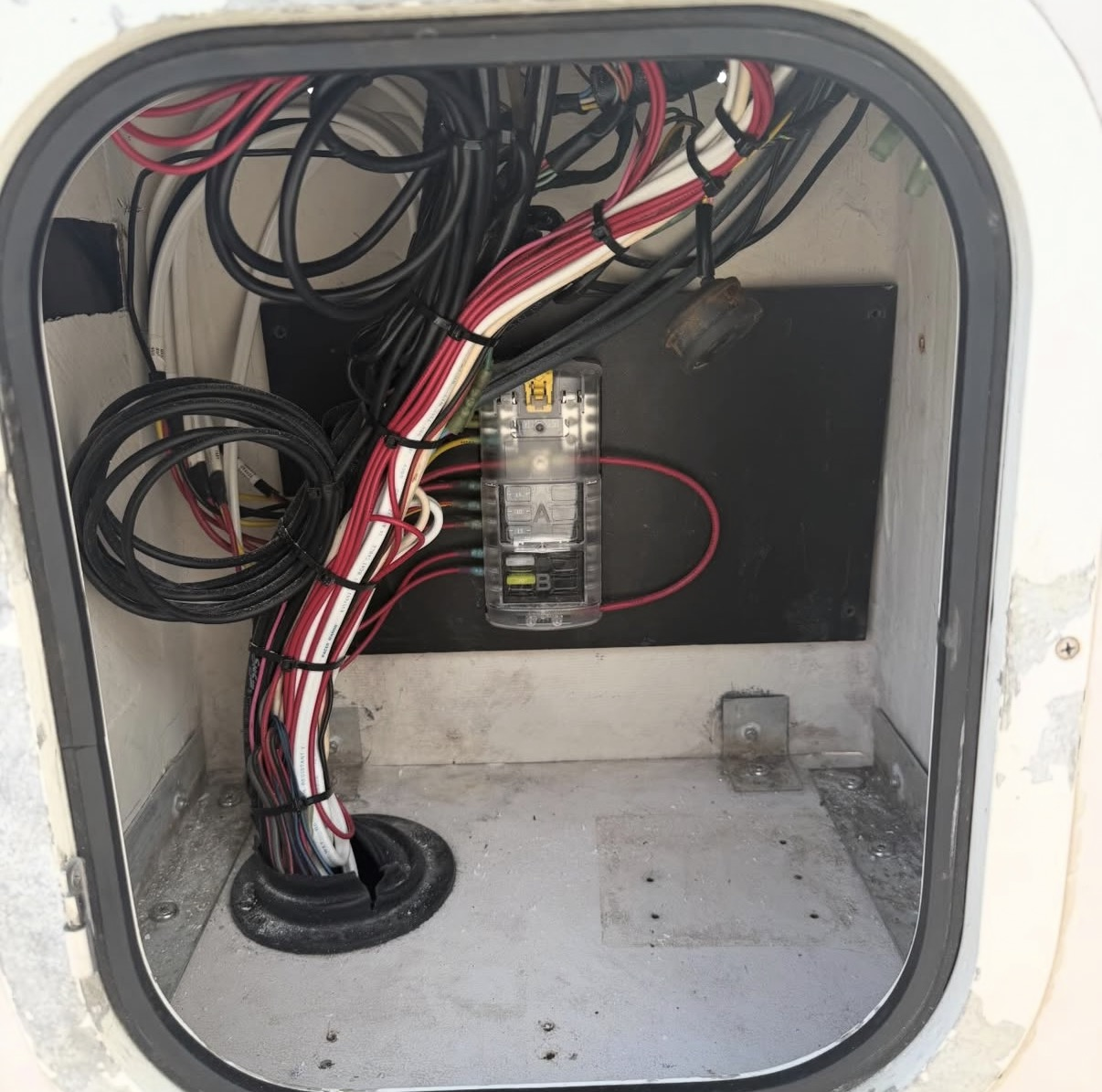 The same console wiring bundled, loomed, and organized with a clean fuse block