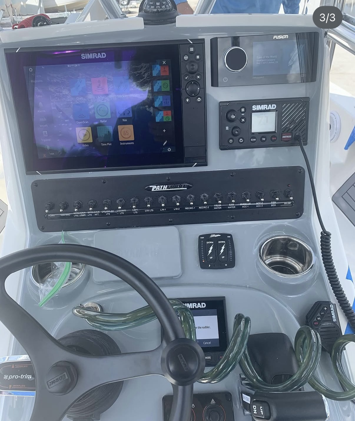 Finished Pathfinder helm with Simrad display, Fusion stereo, and VHF radio